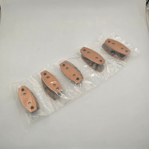 Brake pad friction surface and backing plate detail for titanium rotor use