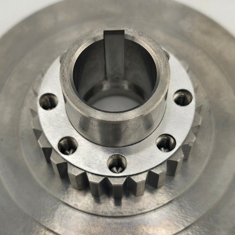 Silver .010 inch clutch shim shown next to clutch lever plate hardware