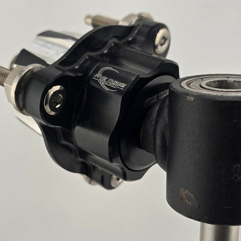 Dust cover shown next to a front hub bearing for size reference