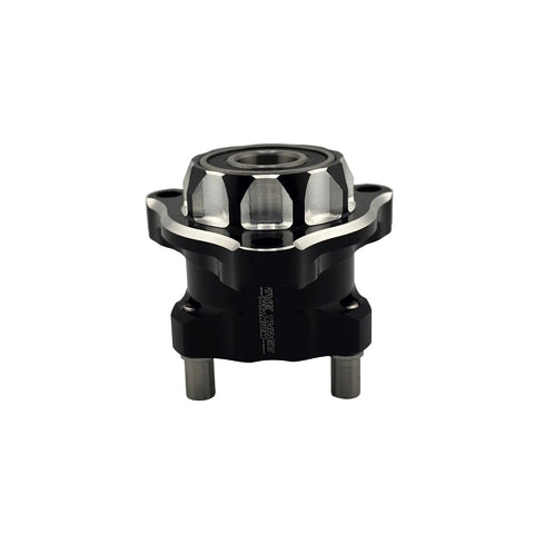 Face of the left front brake hub showing the Revolver machined weight relief pockets