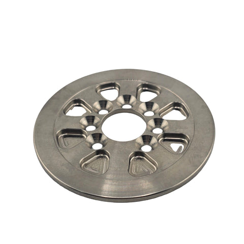 Back face of the titanium clutch drive plate showing countersunk bolt holes