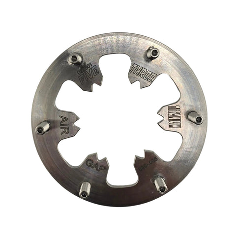 Back of the titanium pressure plate showing adhesive-bonded studs