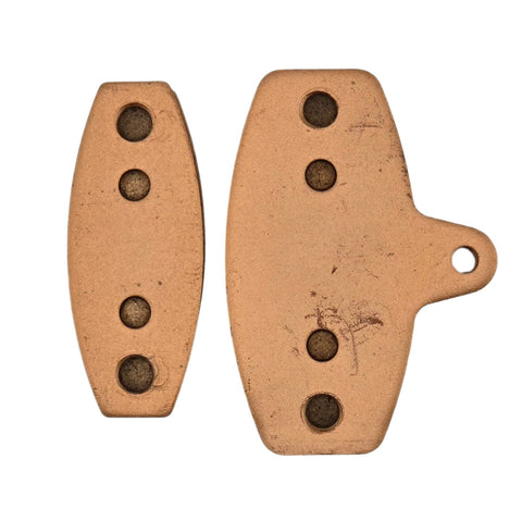 Mini Lite and big titanium specific brake pads shown side by side for size comparison